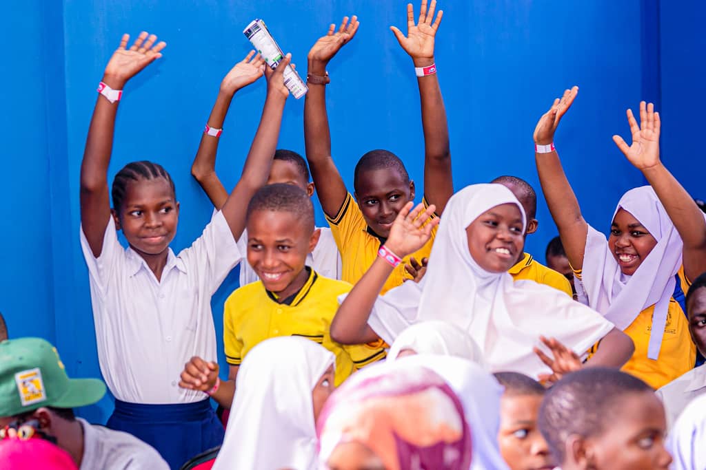 Excited students raising their hands